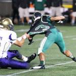 Oak Harbor&rsquo;s Ozell Jackson pulls down Getchell&rsquo;s Ryan Hascall. (Photo by John Fisken)