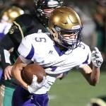 Shingo Johnston takes off on a 27-yard touchdown run for the Wildcats.(Photo by John Fisken)