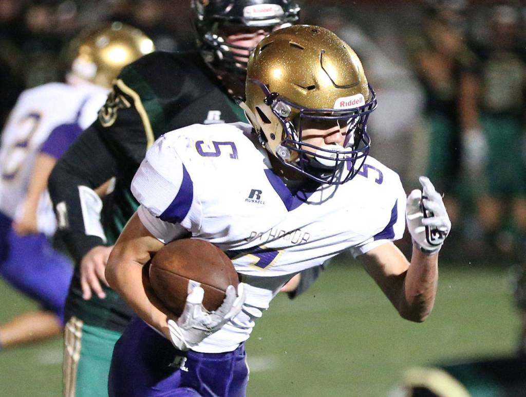 Shingo Johnston takes off on a 27-yard touchdown run for the Wildcats.(Photo by John Fisken)