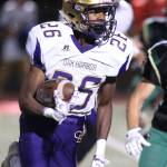 TJ Hollins-Passmore runs for a chunk of yardage Friday.(Photo by John Fisken)