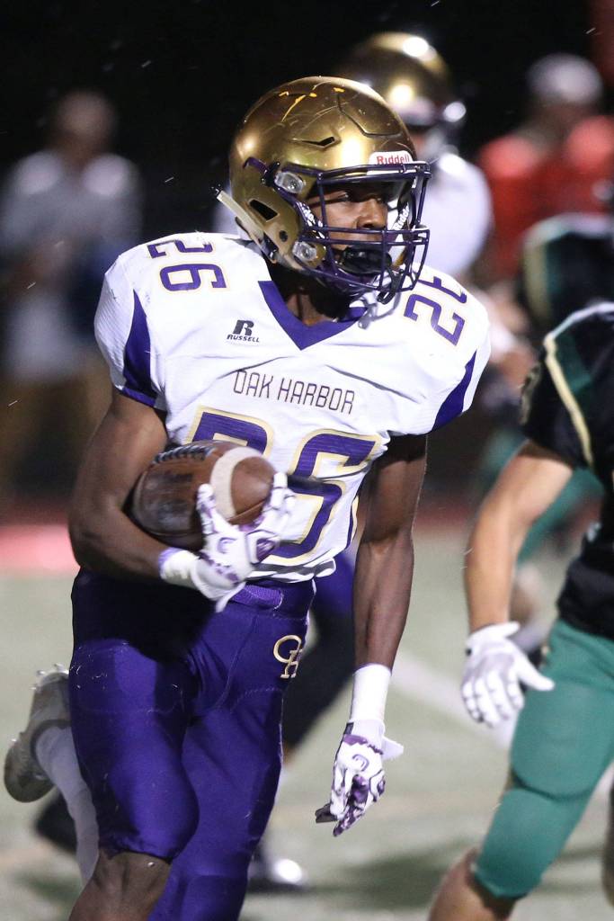 TJ Hollins-Passmore runs for a chunk of yardage Friday.(Photo by John Fisken)