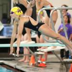 Caitlin Dennen takes off in the 400 freestyle relay. (Photo by John Fisken)