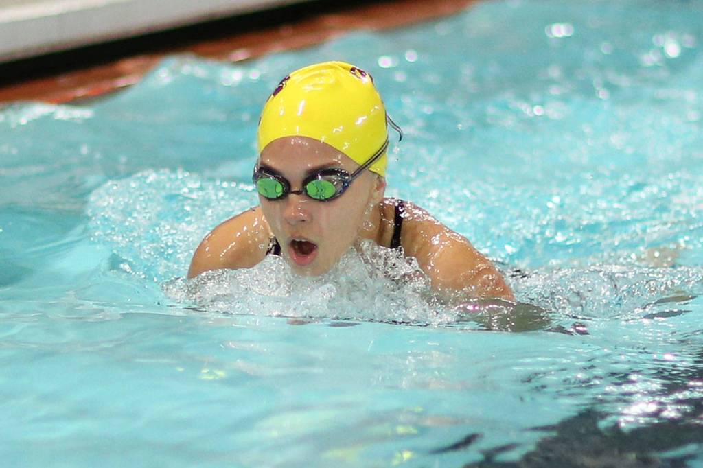 Noelle Ruiz picks up a team point by placing fifth in the 100-meter breaststroke.(Photo by John Fisken)