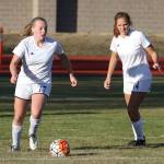 Sage Renninger, left, looks for an opening as Ema Smith trails the play.(Photo by John Fisken)