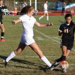Coupeville&rsquo;s Ema Smith beats Sequim&rsquo;s Kristina Mingoy (14) to the ball.(Photo by John Fisken)