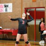 Maya Toomey-Stout serves against Sequim Tuesday.(Photo by John Fisken)