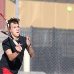 Nick Etzell returns a shot in his doubles win Tuesday. (Photo by John Fisken)
