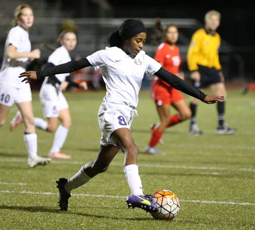 Jessica Vester takes control of the ball for the Wildcats.(Photo by John Fisken)