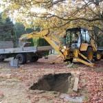 Jessie Stensland / Whidbey News-Times                                Mike Case Smith digs a grave with a backhoe in Oak Harbor&rsquo;s Maple Leaf Cemetery this week.
