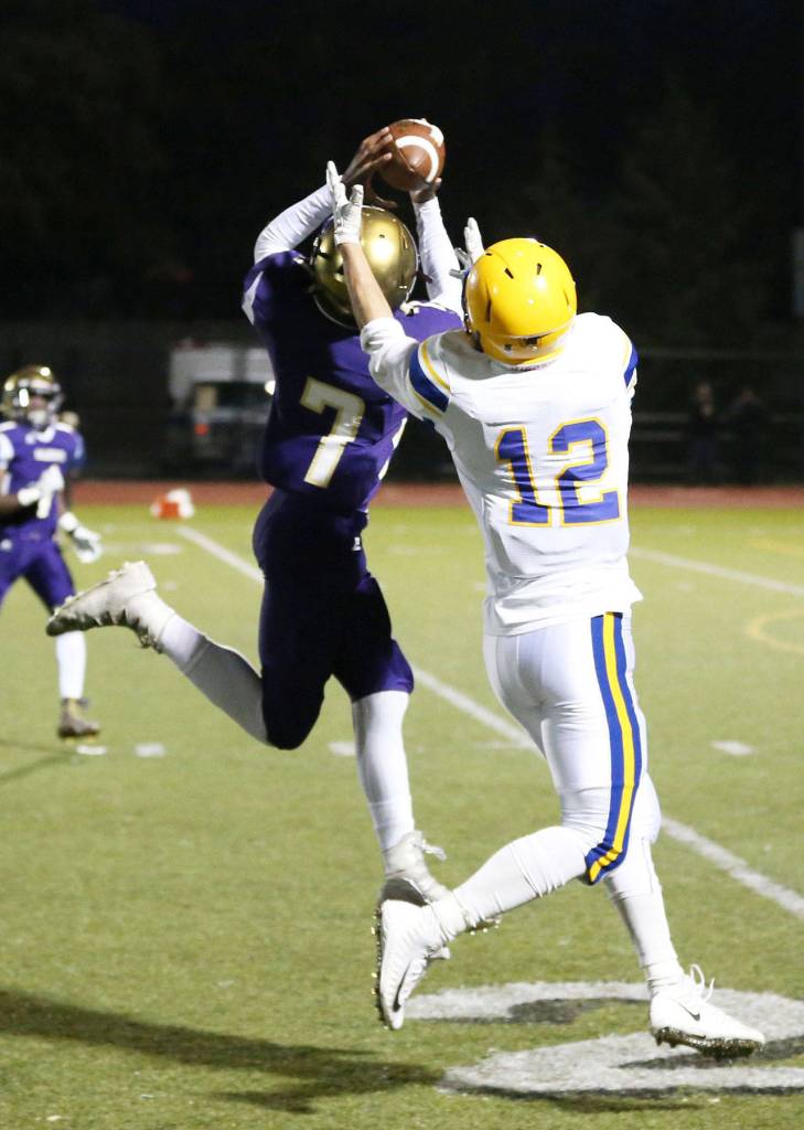 Dorian Hardin cuts in front of Ferndale&rsquo;s Jared Emmert for the first of his two interception Friday.(Photo by John Fisken)