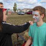 What would a homecoming parade be without some face paint? (Photo by John Fisken)