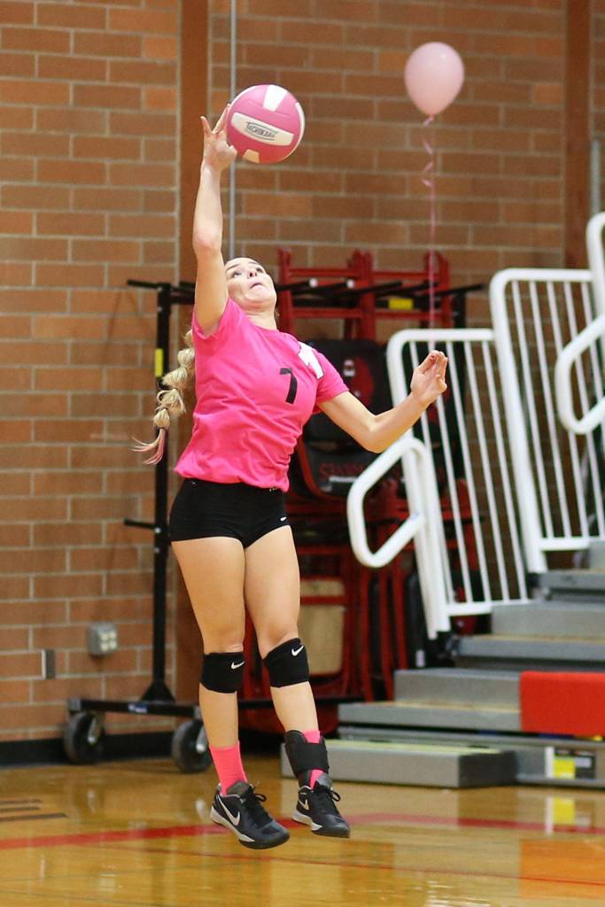 Hope Lodell fires a serve for the Wolves.(Photo by John Fisken)