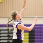 Hailee Blau attacks from the back row for the Wildcats. (Photo by John Fisken)