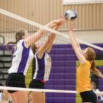 Hailee Blau, left, and Leielle Salinger block a tip by Shorecrest&rsquo;s Claire Perrin.(Photo by John Fisken)