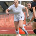 Maddie Hilkey attempts to beat a Klahowya player to the ball.(Photo by John Fisken)
