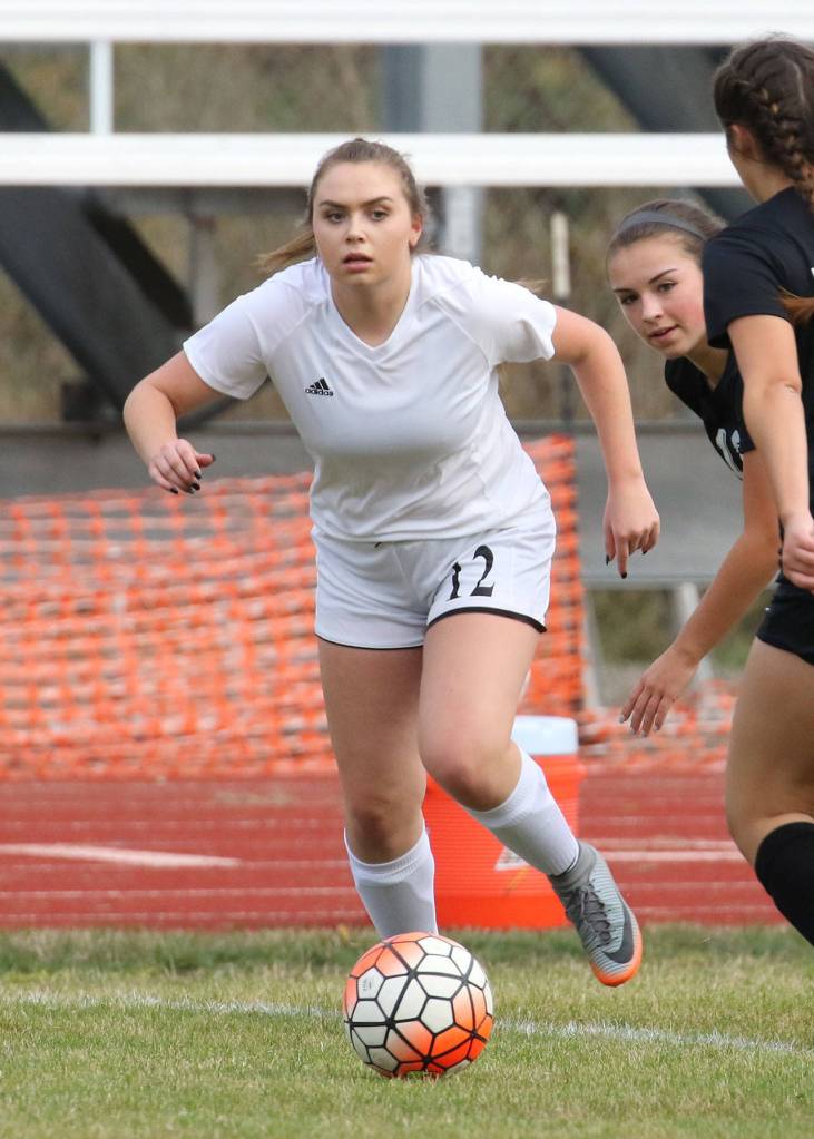 Maddie Hilkey attempts to beat a Klahowya player to the ball.(Photo by John Fisken)