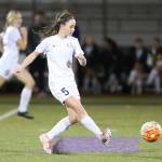 Aidan Anderson, who scored a goal later in the match, boots the ball for Oak Harbor.(Photo by John Fisken)