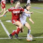 Jenna Cooley tangles with Terrace&rsquo;s Abbi Johnson (4) for possession.(Photo by John Fisken)