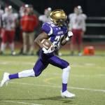 TJ Hollins-Passmore picks up some yardage for the Wildcats.(Photo by John Fisken)