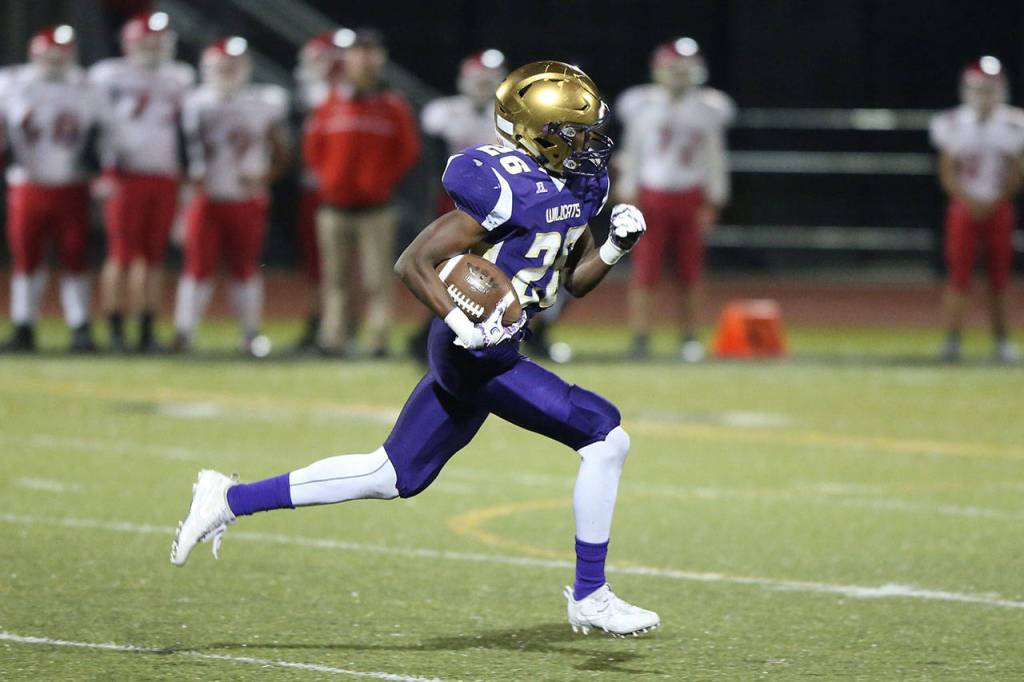 TJ Hollins-Passmore picks up some yardage for the Wildcats.(Photo by John Fisken)