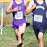 Oak Harbor&rsquo;s Ben Gasper, left, competes with an Arlingtopn runner at the district meet.(Photo by John Fisken)