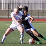 Sage Renninger, left, battles Vashon Island&rsquo;s Emily Serebryakov for possession.(Photo by John Fisken)