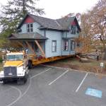 Photo provided by Bill Waite                                A historic home is moved from a site next to the Oak Harbor Presbyterian Church this week. The movers used trucks and a barge.