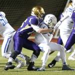 Hunter Bos wraps up Seattle Prep&rsquo;s Brennan Holmes. (Photo by John Fisken)