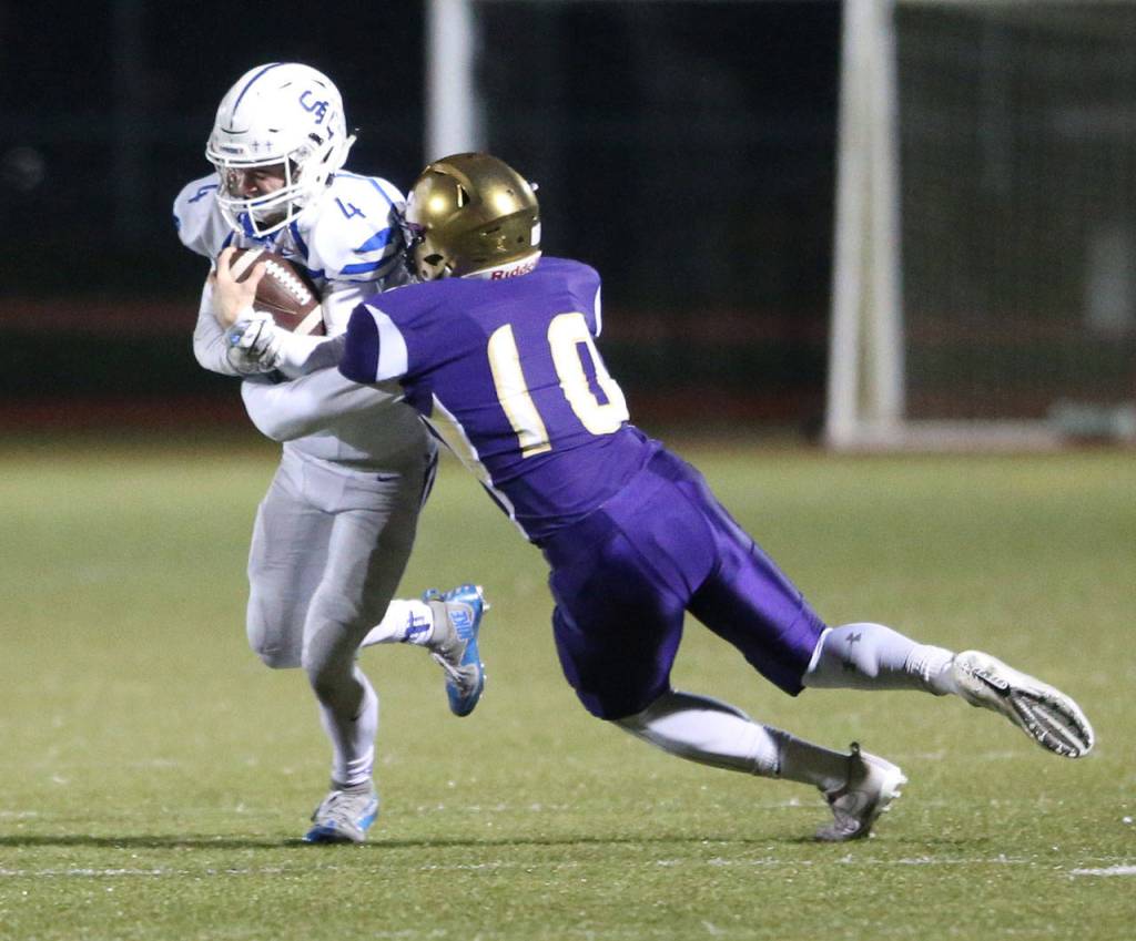 Mac Carr brings down Brennan Holmes after a reception.(Photo by John Fisken)