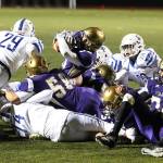 Above: Aaron Martinez punches the ball in from the 1-yard line for a Wildcat touchdown. Below: Martinez fumbled the ball after breaking the plane and Ozell Jackson (76) recovers.(Photos by John Fisken)