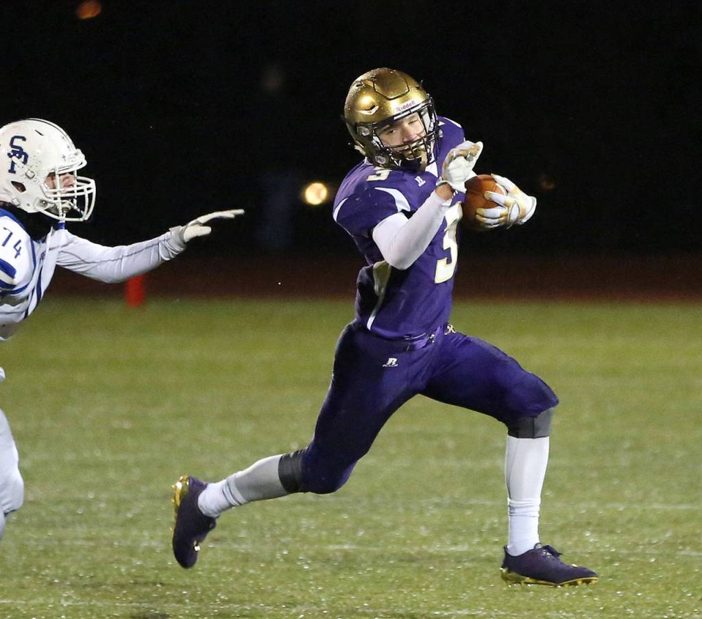 Andrew Miller evades a Seattle Prep defender.(Photo by John Fisken)