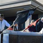 Each year, a different representative presents the flag for each branch of the military while Shifty Sailors sing battle hyms. File Photo/Whidbey News-Times