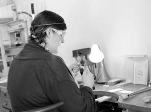 Rosalie Gale photo                                Foamy Wader owner Alexa Allamano works on one of her nautical-themes pieces of jewelry in her Langley storefront.