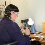 Rosalie Gale photo  Foamy Wader owner Alexa Allamano works on one of her nautical-themes pieces of jewelry in her Langley storefront.