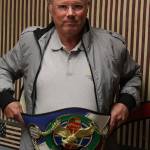 Chuck Yursina shows off the wrestler-style belt he won at last months Long Beach Invitational Cribbage Tournament.