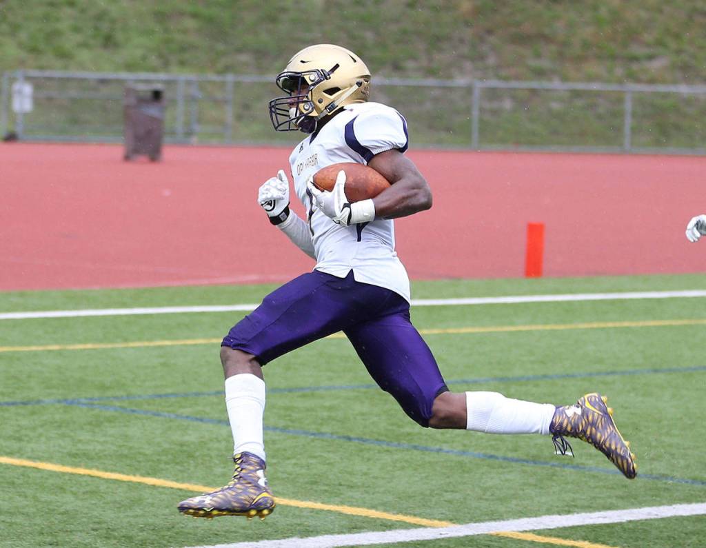 Taeson Hardin puts Oak Harbor on the scoreboard with a 3-yard TD run.(Photo by John Fisken)