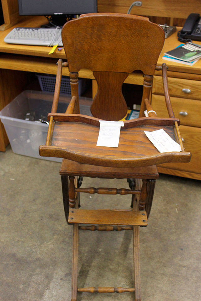 This antique high chair is also a pint-size rocking chair.