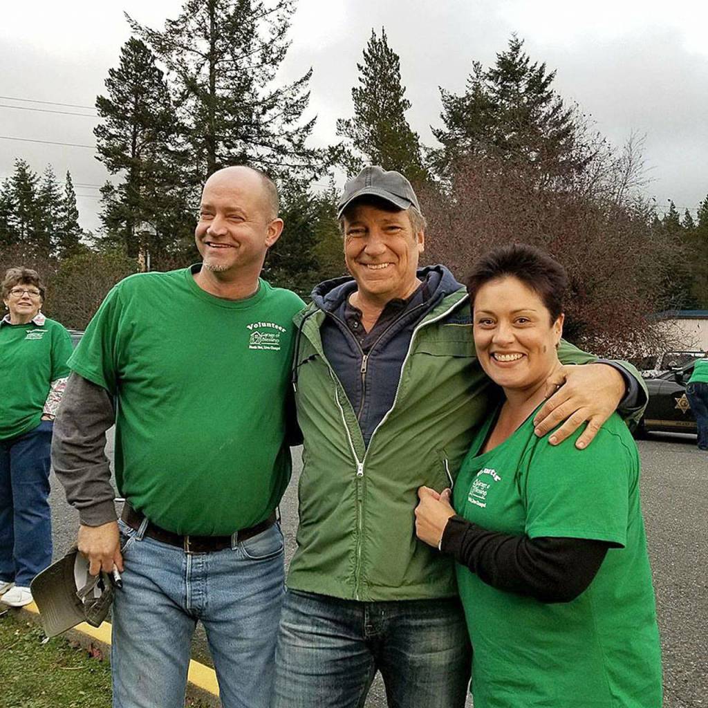 Mike Rowe, of Dirty Jobs, poses with Kristiina Miller, founder and owner of Garage of Blessings and her husband Jason Miller (left). Rowe helped the garage expand its space, pay for two years rent and obtain a new van to pick up donations as part of his new show Returning the Favor. Photo provided by Kristiina Miller