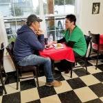 Mike Rowe, of Dirty Jobs and Deadliest Catch, interviews Kristiina Miller, founder and owner of Garage of Blessings, at Chris Bakery Wednesday for his new show Returning the Favor. Rowe surprised Miller with an expansion of the garages space, a check for two years rent and a new van. Photo provided by Kristiina Miller