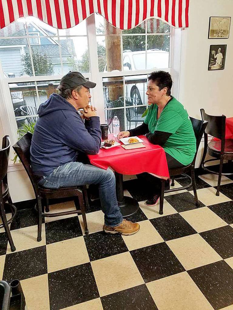 Mike Rowe, of Dirty Jobs and Deadliest Catch, interviews Kristiina Miller, founder and owner of Garage of Blessings, at Chris Bakery Wednesday for his new show Returning the Favor. Rowe surprised Miller with an expansion of the garages space, a check for two years rent and a new van. Photo provided by Kristiina Miller