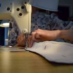 Kyle Jensen / The Record  Francisco stitches a piece of fabric using her sewing machine.