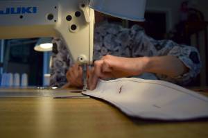 Kyle Jensen / The Record  Francisco stitches a piece of fabric using her sewing machine.