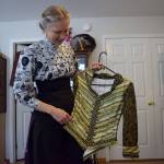 Kyle Jensen / The Record  Francisco holds up an example of steampunk clothing. The style is Victorian, but there are modern touches with the button work.