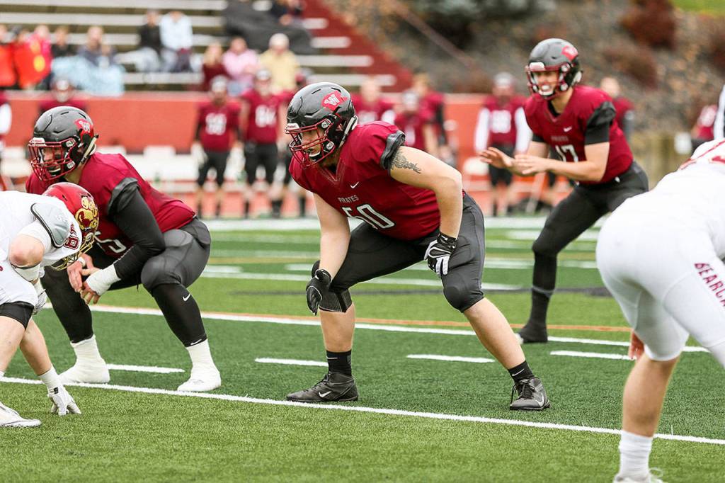 Tyler Adamson, center, earned first-team honors for the second consecutive year for Whitworth University.(Photo courtesy of Whitworth Athletics)