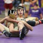 Hunter Hogarth, back right, and Justin Go tangle Monday. (Photo by John Fisken)