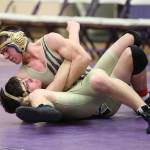 Dylan Sanchez, top, tries to pin Evan Beerbower.(Photo by John Fisken)