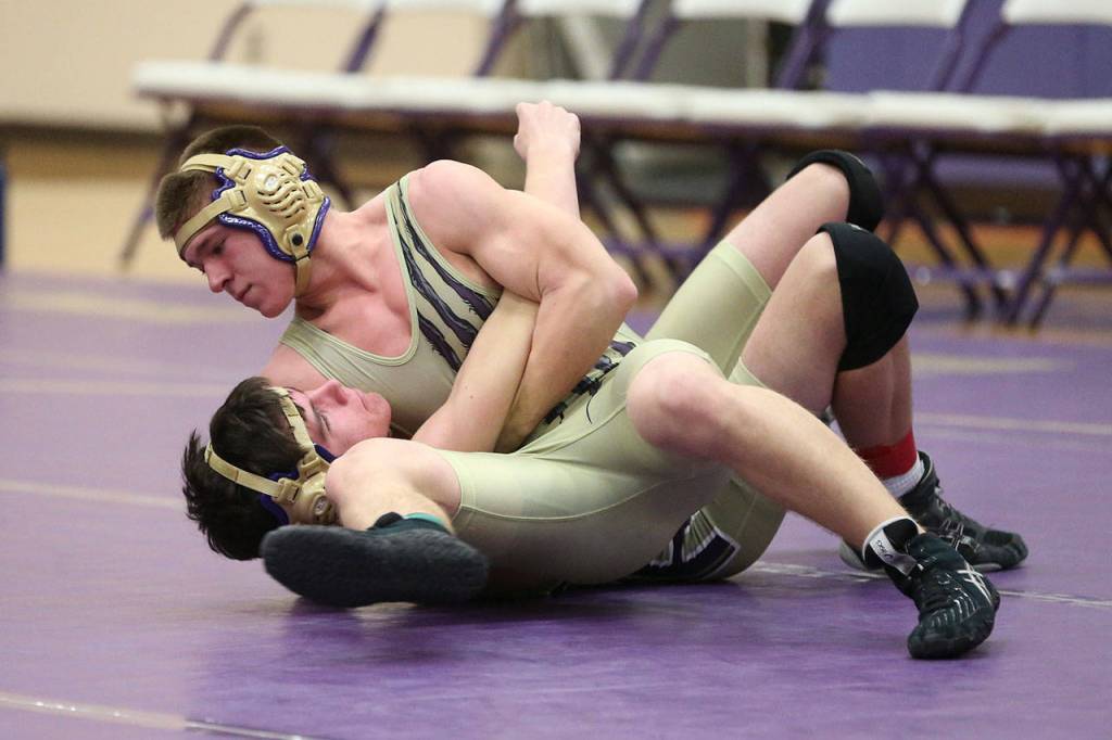 Dylan Sanchez, top, tries to pin Evan Beerbower.(Photo by John Fisken)
