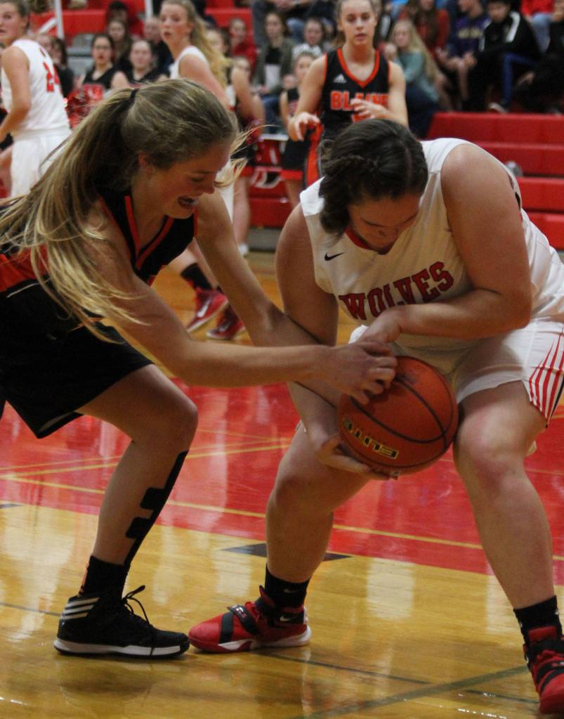 Coupevilles Sarah Wrights rips the ball away from Blaines Camryn Vosloh.(Photo by Jim Waller/Whidbey News-Times)