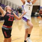 Jordan Ford flies by Mountlake Terraces Jasmine Zenk for two points.(Photo by John Fisken)