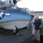PBY Naval Museum board chairman Richard Rezabek gives a tour of the PBY 5-A Catalina seaplane thats a popular attraction. However, sometimes theres not enough volunteers to accompany visitors to the plane, he says.                                Photo by Patricia Guthrie/Whidbey News-Times
